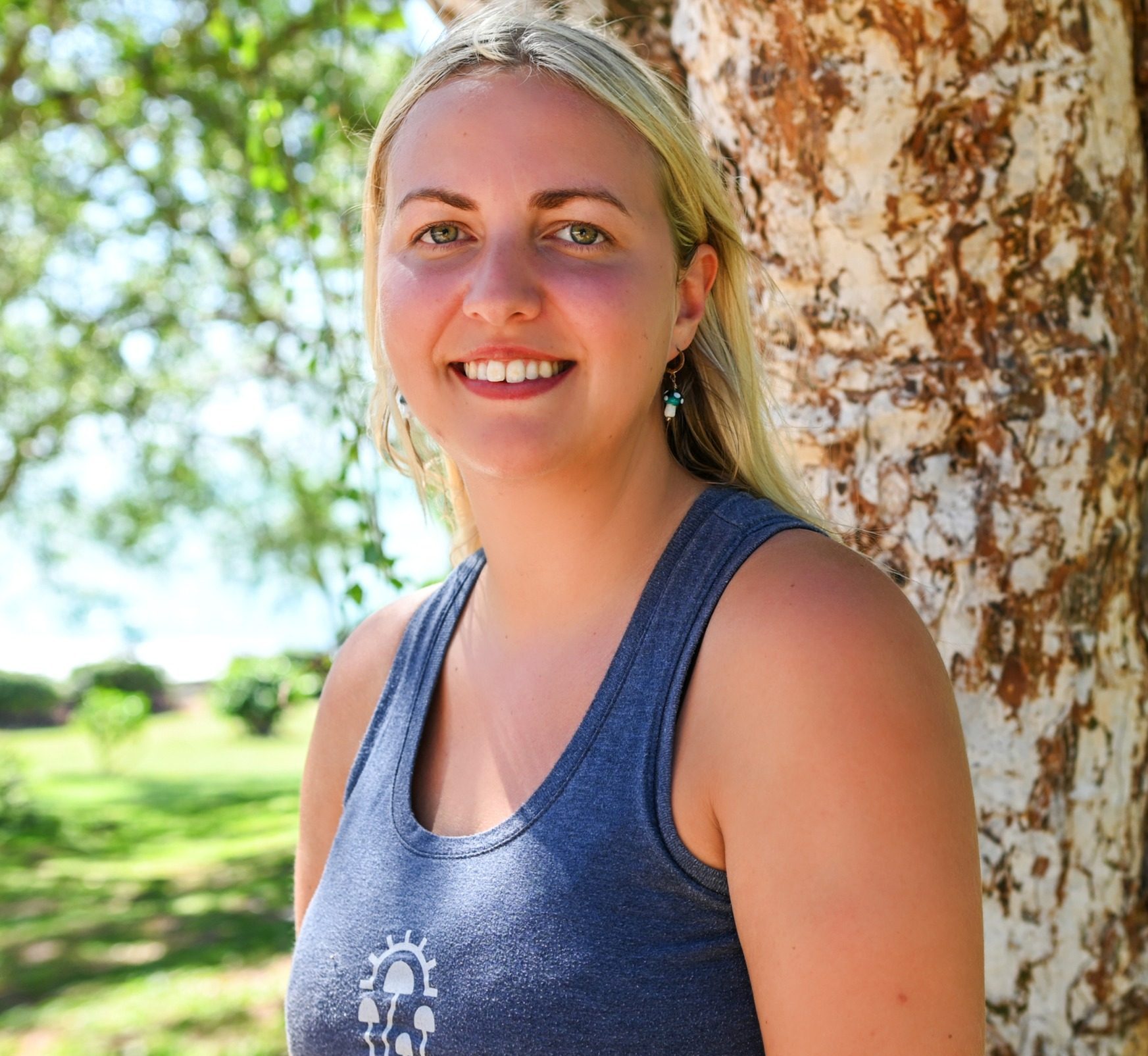 therapist at mycomeditations retreat standing by a tree