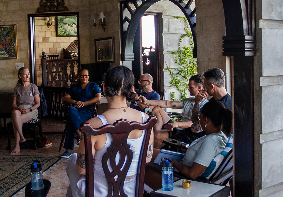 Therapist guiding group integration circle at MycoMeditations.