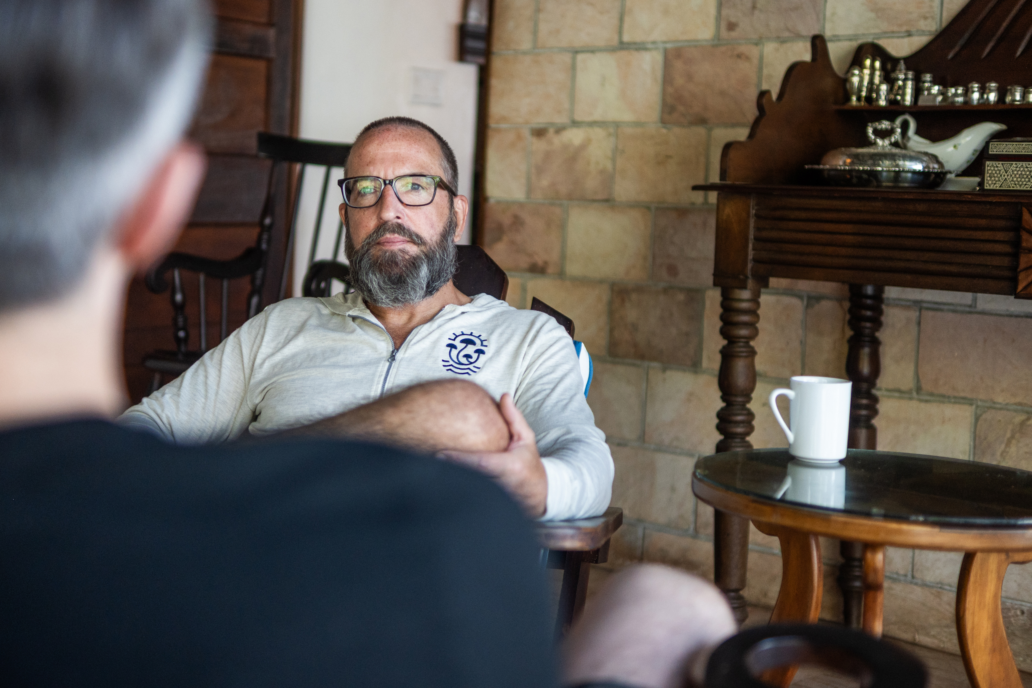 MycoMeditations CEO, Justin Townsend, working with a guest at his psilocybin retreat.