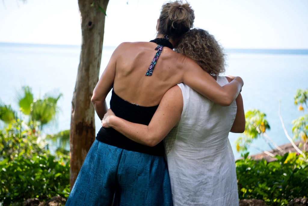 Two MycoMeditations guests hugging eachother after their psilocybin therapy sessions.